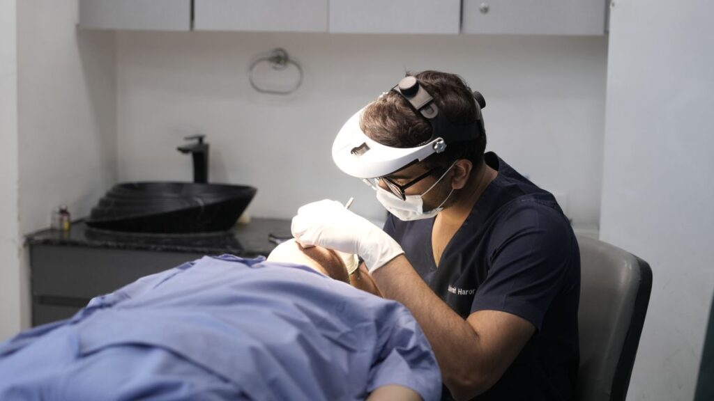pexels-photo-32260064-32260064 A dermatologist performing a procedure in a clinical setting in Delhi, India.
